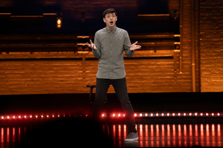 Alex Edelman onstage in his HBO special Just For Us.